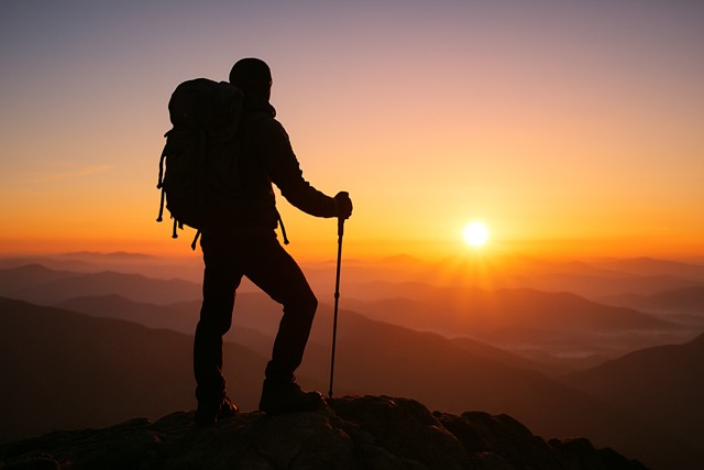 hiker_sunset_mountain_peak